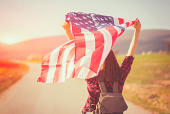 person holding american flag