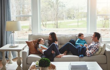 happy family with two kids on couch