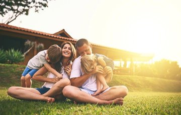 family relaxing in yard